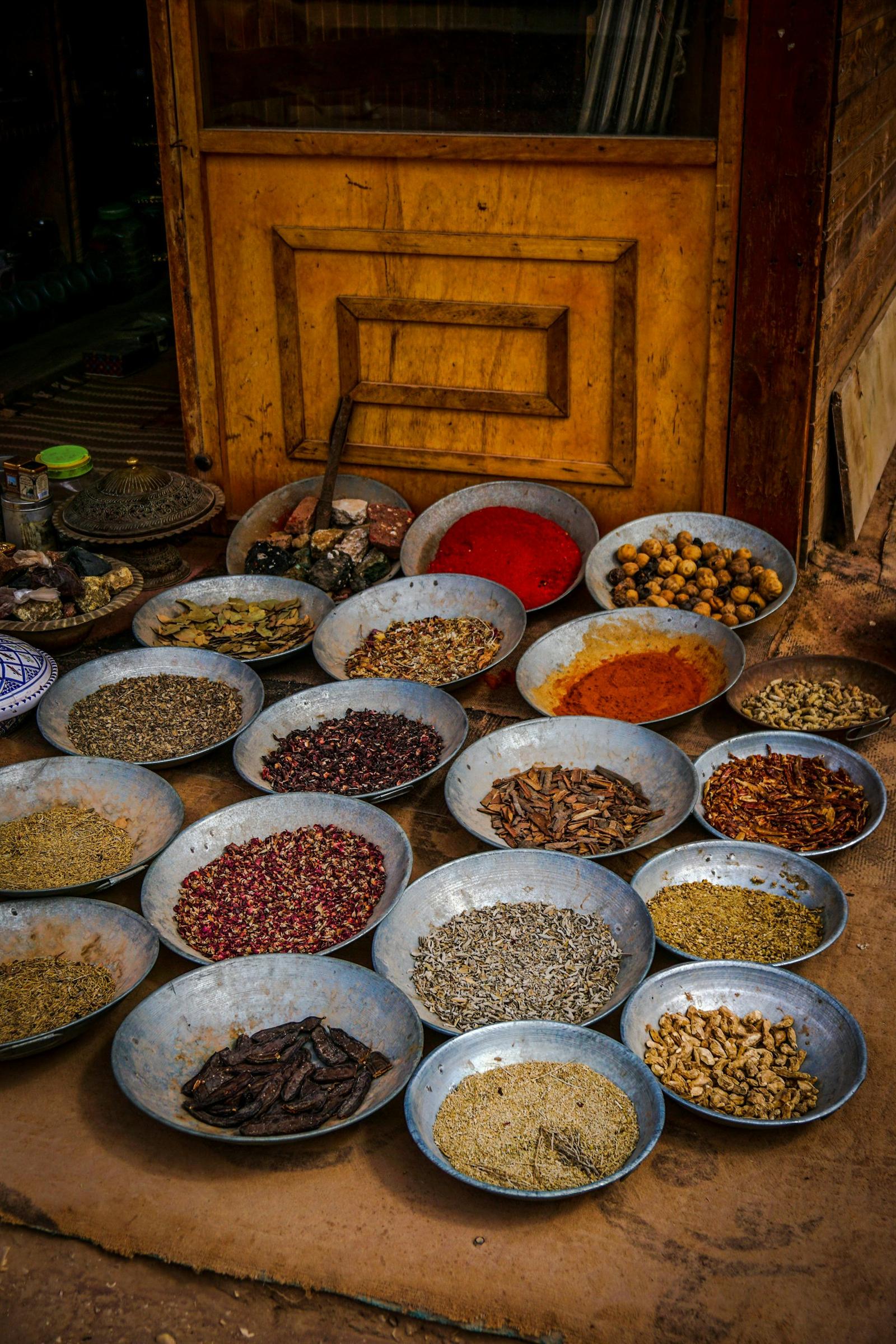 Bowls of spices and grains at an Indian market stall